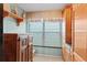 Bright alcove with natural light, decorative wooden cabinet, and window with adjustable blinds at 7907 Sailboat Key S Blvd # 108, South Pasadena, FL 33707