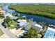 Beautiful aerial of the property, highlighting waterfront access and a lush mangrove backdrop at 909 Silver Palm Way, Apollo Beach, FL 33572