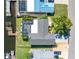 An aerial view of the home with screened pool, boat dock, and waterfront access to channel at 909 Silver Palm Way, Apollo Beach, FL 33572