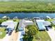 Overhead view featuring the house and its canal front location with quick access to the bay at 909 Silver Palm Way, Apollo Beach, FL 33572