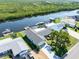 Overhead of neighborhood, showing canal access, docks and mature trees at 909 Silver Palm Way, Apollo Beach, FL 33572