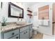 Updated bathroom with granite counters, vessel sink, and modern fixtures at 909 Silver Palm Way, Apollo Beach, FL 33572