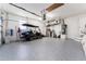 Spacious garage featuring epoxy floors, storage, and a golf cart at 909 Silver Palm Way, Apollo Beach, FL 33572