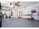Well-organized garage with epoxy floors, ample storage, and space for vehicles at 909 Silver Palm Way, Apollo Beach, FL 33572