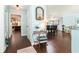 An open floor plan with wood floors, flowing from the entrance to the dining area and living spaces at 909 Silver Palm Way, Apollo Beach, FL 33572