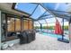 Screened pool with beautiful water views and outdoor kitchen at 909 Silver Palm Way, Apollo Beach, FL 33572