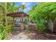 Outdoor space featuring a wooden pergola and a relaxing hot tub at 1042 S Sterling Ave, Tampa, FL 33629