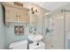 Bathroom with modern glass shower, unique decor, and convenient storage shelves at 1042 S Sterling Ave, Tampa, FL 33629