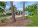 Charming coastal home with a spacious carport, well-maintained landscaping, and a classic vintage truck at 1042 S Sterling Ave, Tampa, FL 33629