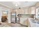 Updated kitchen showcasing stainless steel appliances, granite countertops, and tiled floor at 1042 S Sterling Ave, Tampa, FL 33629