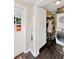 Laundry room with washer and dryer, storage cabinets and convenient access to back door at 1042 S Sterling Ave, Tampa, FL 33629