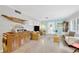 Open-concept living room boasts terrazzo floors, wicker chairs, and eclectic decor at 1042 S Sterling Ave, Tampa, FL 33629