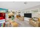 Open-concept living space with terrazzo floors, comfortable seating, and stylish decor creating a welcoming atmosphere at 1042 S Sterling Ave, Tampa, FL 33629