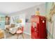 Comfortable living room featuring vintage Coca-Cola machine and plantation shutters for added privacy at 1042 S Sterling Ave, Tampa, FL 33629