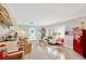 Bright living room featuring terrazzo floors, coastal decor, and an open layout, perfect for entertaining at 1042 S Sterling Ave, Tampa, FL 33629