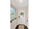 Welcoming mud room with window, beadboard, and convenient key hooks at 1042 S Sterling Ave, Tampa, FL 33629