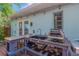 Outdoor kitchen with stone counters, sink, and pizza oven attached to the exterior of the home at 1042 S Sterling Ave, Tampa, FL 33629