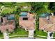 An aerial view of a beautiful home featuring a private pool, spa and manicured landscaping at 1358 Forestedge Blvd, Oldsmar, FL 34677