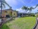 Expansive backyard with screened-in pool area and mature landscaping enhances the property's appeal at 1358 Forestedge Blvd, Oldsmar, FL 34677