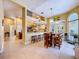 Bright open kitchen featuring an island with bar seating and modern appliances at 1358 Forestedge Blvd, Oldsmar, FL 34677