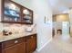 Butlers pantry features granite countertop, and custom cabinets with ample storage space at 1358 Forestedge Blvd, Oldsmar, FL 34677
