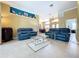Spacious living room with tile flooring, neutral walls, and comfortable seating at 1358 Forestedge Blvd, Oldsmar, FL 34677