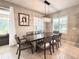 Elegant dining room featuring a modern chandelier and plenty of natural light at 16413 Rivers Reach Blvd, Parrish, FL 34219