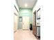 Bright and airy entryway featuring light blue walls and a stylish console table at 16413 Rivers Reach Blvd, Parrish, FL 34219