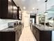 Spacious kitchen with stainless steel appliances, granite countertops, and a center island with bar seating at 16413 Rivers Reach Blvd, Parrish, FL 34219