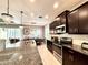 Well-appointed kitchen featuring granite countertops, stainless steel appliances, and ample cabinet space at 16413 Rivers Reach Blvd, Parrish, FL 34219