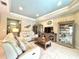 Cozy living room with tile floors, comfortable seating, and stylish decor at 16413 Rivers Reach Blvd, Parrish, FL 34219