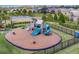 Community playground with slides, climbing structures, and safety fencing at 16413 Rivers Reach Blvd, Parrish, FL 34219