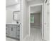 Well-lit bathroom with vanity and gray cabinets at 18504 Putters Pl, Tampa, FL 33647