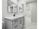 Gray bathroom with vanity and modern mirror at 18504 Putters Pl, Tampa, FL 33647