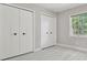 Bedroom with modern closets and natural light at 18504 Putters Pl, Tampa, FL 33647