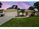 Charming single-story home with a well-manicured lawn and a two-car garage at 18504 Putters Pl, Tampa, FL 33647