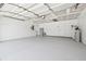 Spacious garage with painted floor at 18504 Putters Pl, Tampa, FL 33647