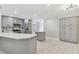 Modern kitchen with gray cabinets, stainless appliances, and an eat-in area at 18504 Putters Pl, Tampa, FL 33647