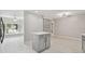 Modern kitchen with gray cabinets, stainless appliances, and an eat-in area at 18504 Putters Pl, Tampa, FL 33647