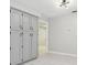 Pantry or utility closet off the modern kitchen with overhead lighting at 18504 Putters Pl, Tampa, FL 33647