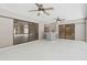 Bright and airy patio featuring two ceiling fans, offering views of the garden and seamless indoor-outdoor living at 18504 Putters Pl, Tampa, FL 33647