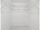 Empty walk-in closet with wire shelving, offering ample storage space at 18504 Putters Pl, Tampa, FL 33647