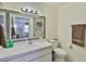 Bathroom with a large mirror above the sink and a shower visible through the mirror's reflection at 1905 Canterbury Ln # 17, Sun City Center, FL 33573
