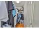 Walk-in closet offering ample storage space with shelving and hanging racks for organization at 1905 Canterbury Ln # 17, Sun City Center, FL 33573