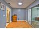 Neutral empty room with hardwood floors, built-in lighting, and sliding glass doors to the outdoor area at 1905 Canterbury Ln # 17, Sun City Center, FL 33573