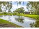 Peaceful backyard view overlooking the calming waters of the nearby lake at 200 Gretchen Ct, Oldsmar, FL 34677