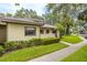 Home's exterior displays well-maintained landscaping and manicured lawn at 200 Gretchen Ct, Oldsmar, FL 34677