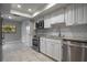 Updated kitchen with white cabinets, granite countertops, and stainless steel appliances at 200 Gretchen Ct, Oldsmar, FL 34677