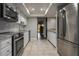 Bright kitchen complete with stainless steel appliances, white cabinets, and tiled flooring at 200 Gretchen Ct, Oldsmar, FL 34677
