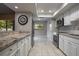 Spacious kitchen boasts stainless steel appliances, granite countertops, and ample cabinet space at 200 Gretchen Ct, Oldsmar, FL 34677